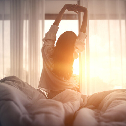 woman waking up refreshed